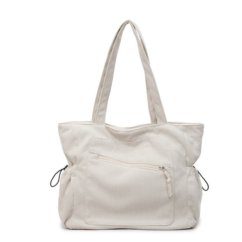 Women's beige corduroy tote bag with zipper and slouchy pockets