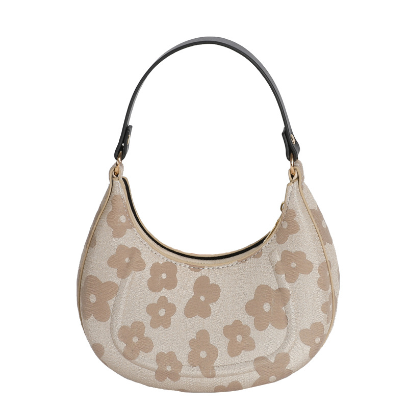 Beige floral jacquard crescent shoulder bag with black strap