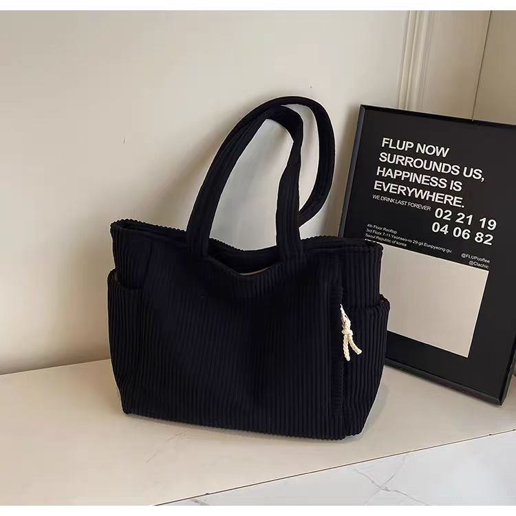 Women's black corduroy tote bag with pockets